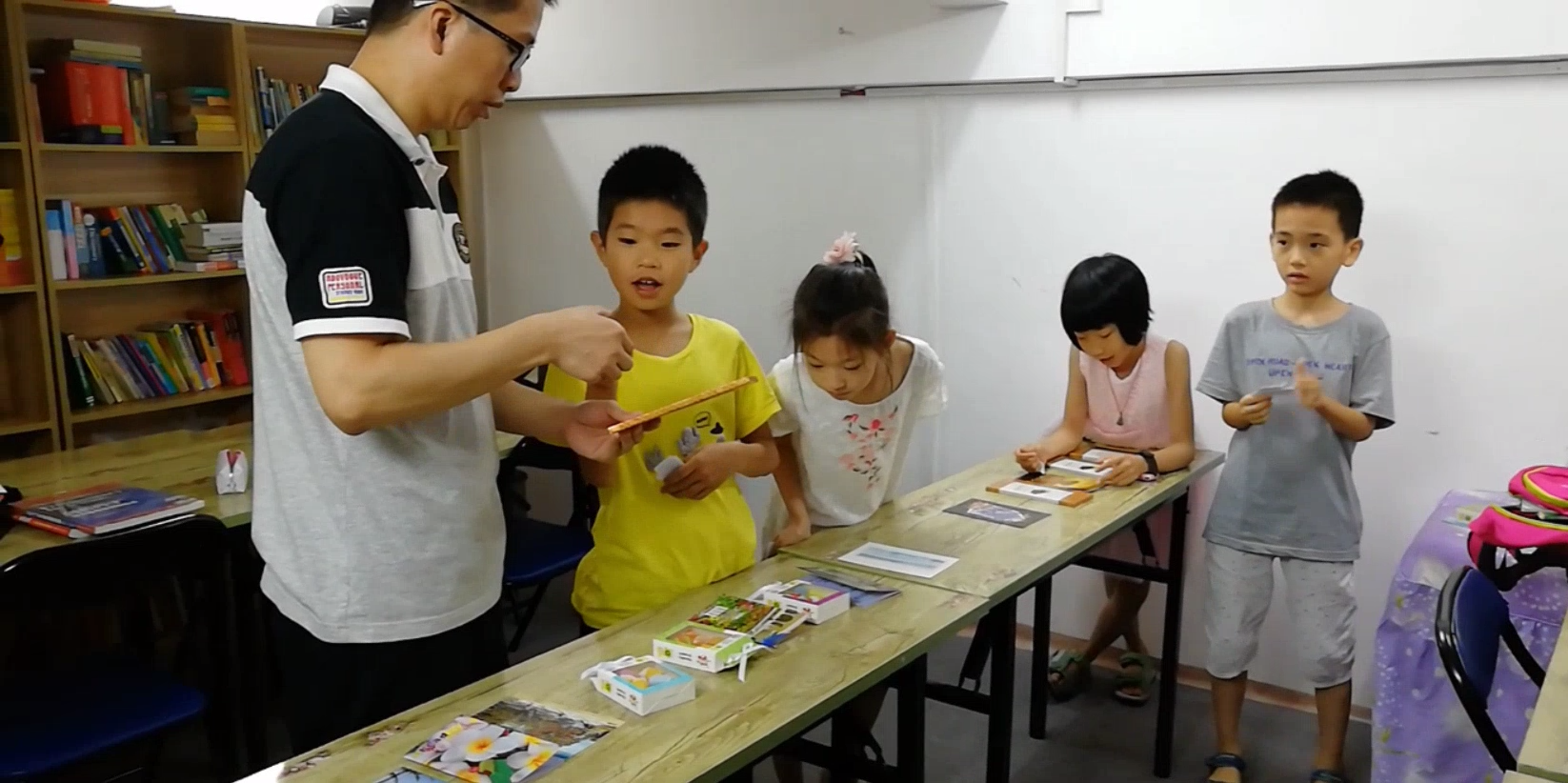 Students practicing English with Mr Yang