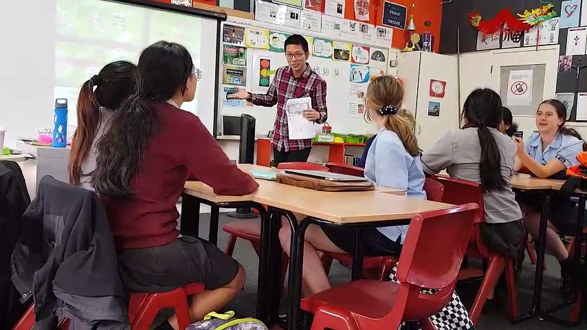 Students learning English in an international classroom